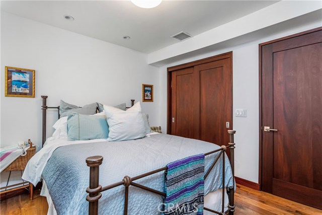 Bedroom with sliding mahogany closet doors