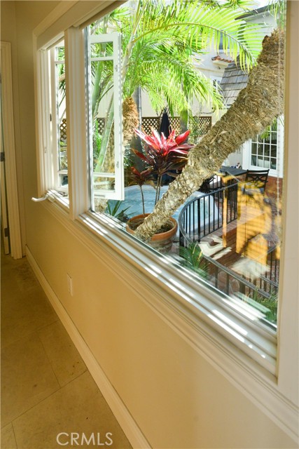 A view of the patio and spa from the office which is separated from the residence by the patio.