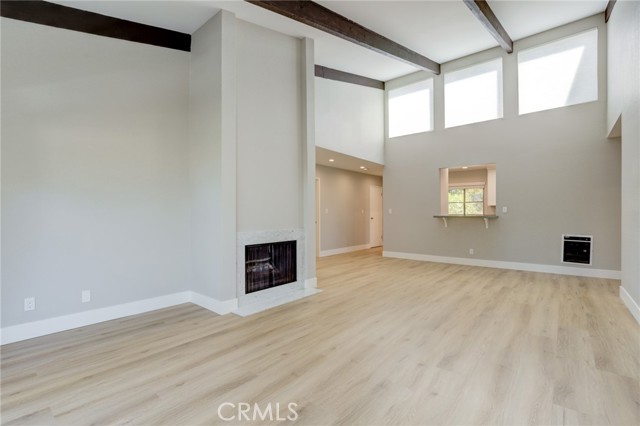 View of living area in to kitchen counter bar