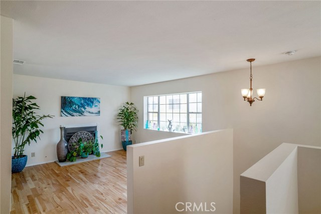 BACK HOUSE: UPSTAIRS LIVING ROOM WITH GAS FIREPLACE.