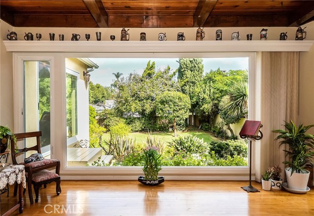 huge family room window to nicely landscaped backyard..