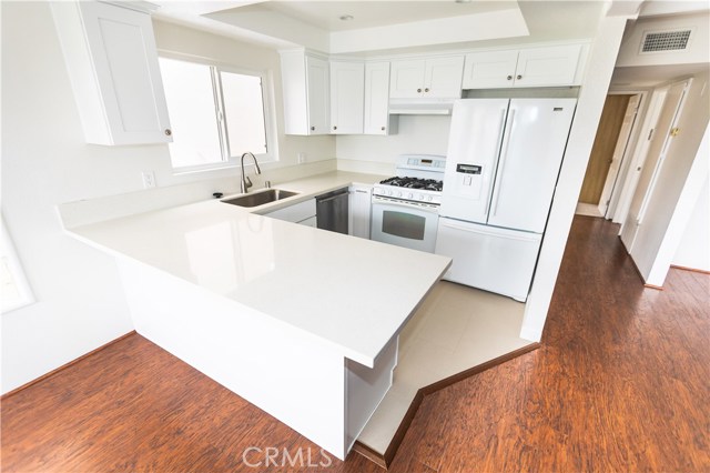 All New Kitchen with quartz counters, new cabinets and new tile floors.