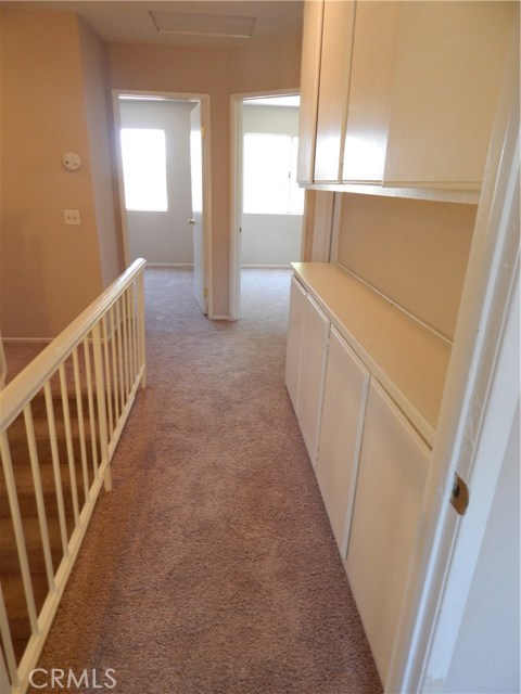 Hallway  with Linen cabinets