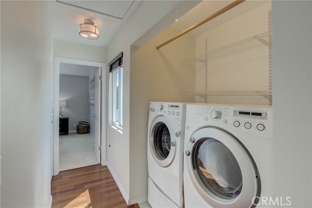 Laundry closet located just outside primary suite
