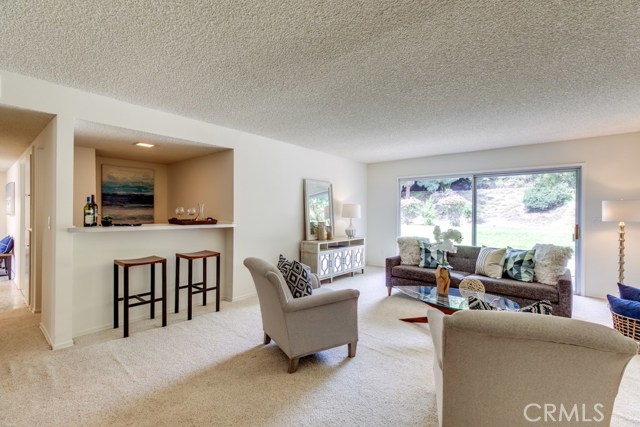 Bar seating and a sliding glass door to the back yard make the family room an excellent entertaining space.