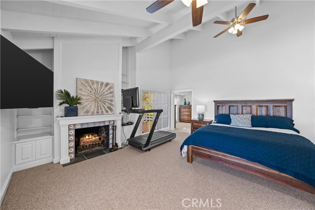 Master Bedroom with fireplace, views of ocean and large bathroom and closets