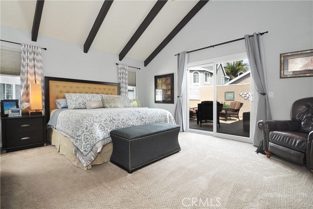 Master bedroom comes with vaulted ceilings and personal direct patio access.