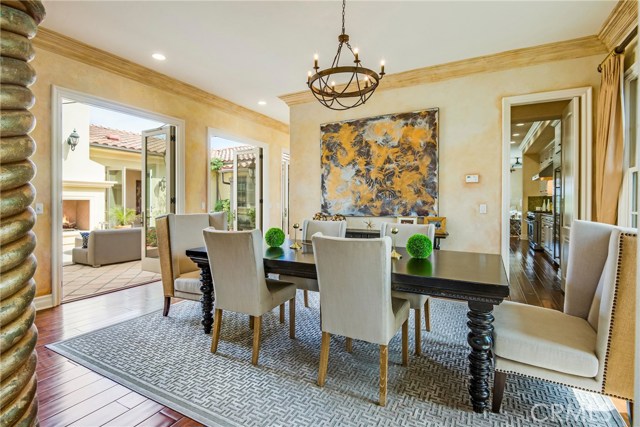 Elegant formal dining next to the Butler pantry and French doors on either side to enjoy the breeze.