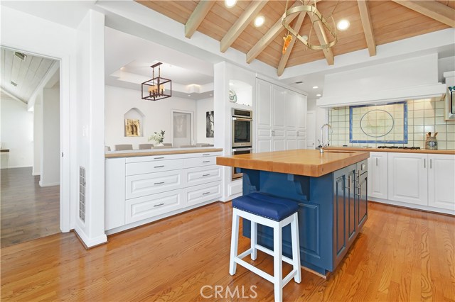 Kitchen - staged with pass view towards dining room