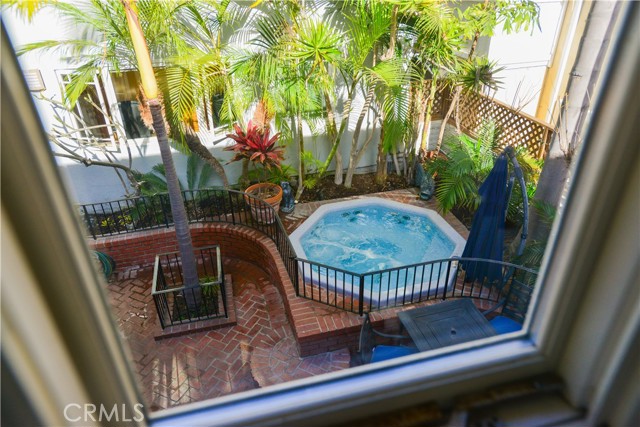 View of spa and patio from master bedroom.