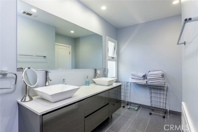 The master bath is a spa in your own home. Cool and contemporary finishes make this a relaxing extension to the master suite.