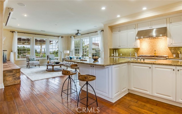 The Family room and Kitchen has an Ocean view, open floorplan, high end appliances, is in great condition and ready to host a gathering of friends and family.