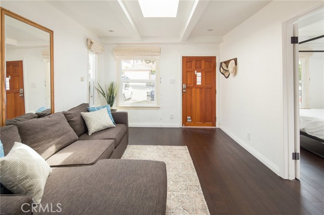 Light and bright living room with skylight and double pane windows.