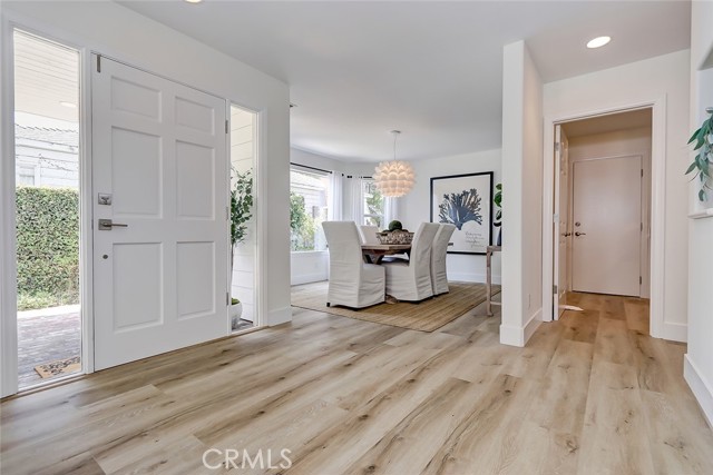 FRONT ENTRY ADJACENT TO FORMAL DINING ROOM AREA