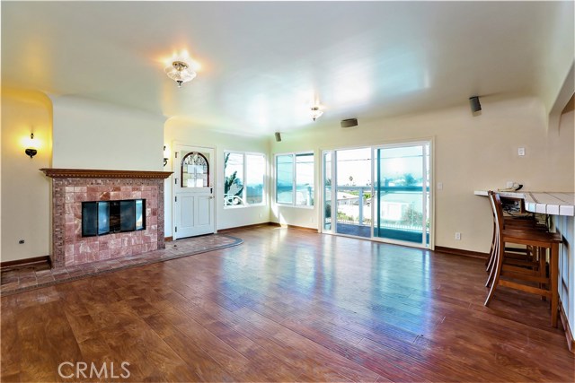 The living room is large and has a tiled gas fireplace.