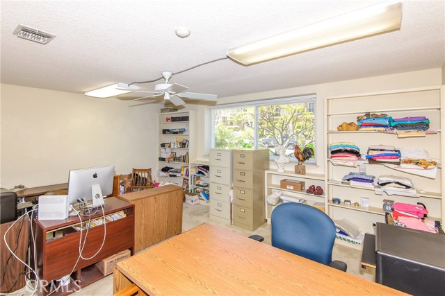 Office (or could become a 4th bedroom) with built-in shelves!