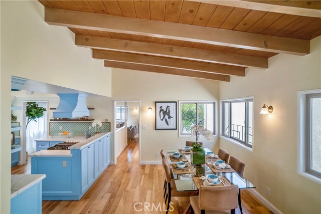 So many beautiful areas to enjoy.. just gorgeous, updated, newer and fresh. Look at those beamed, arched ceilings with that wide plank hardwood floor. Nicely done.