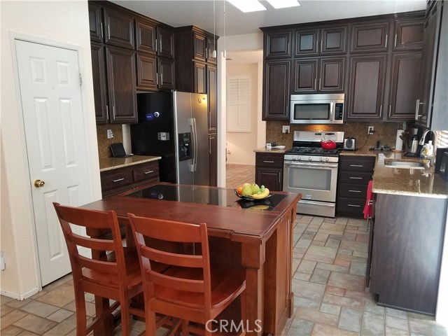 Remodeled Kitchen Includes Extra Cabinets, Stainless Steel Appliances and Walk In Pantry.