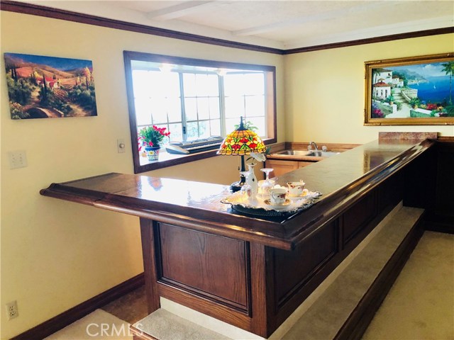 This Wet Bar was designed by a Master Carpenter sink and lots of cupboards it is about 170 inches long with Panoramic Views