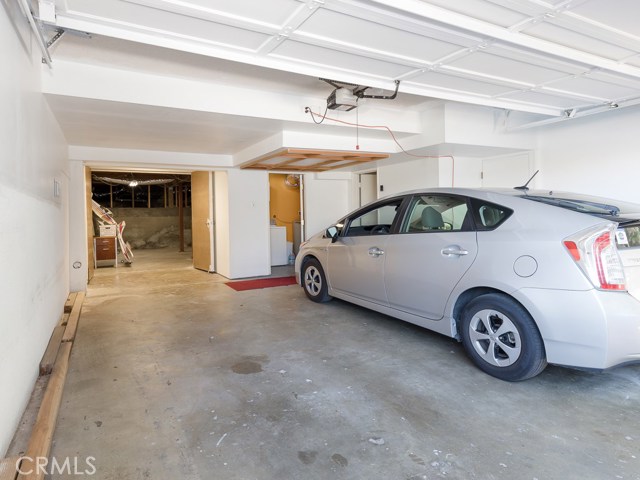 Downstairs attached 2 car garage, laundry, storage and workshop.