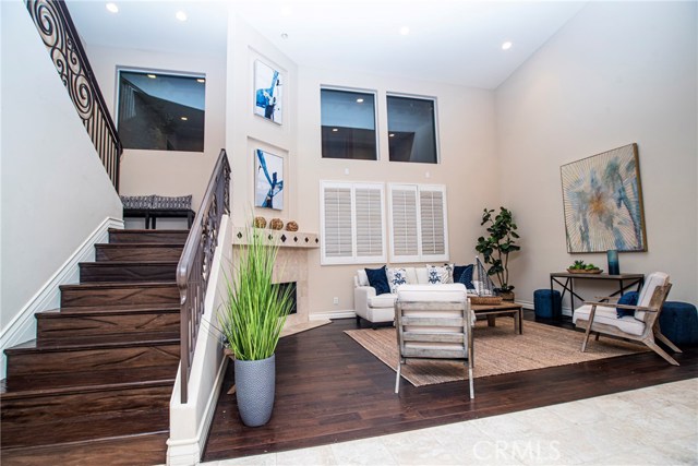 upgraded slightly distressed wood flooring in formal living room as well as up the stairs