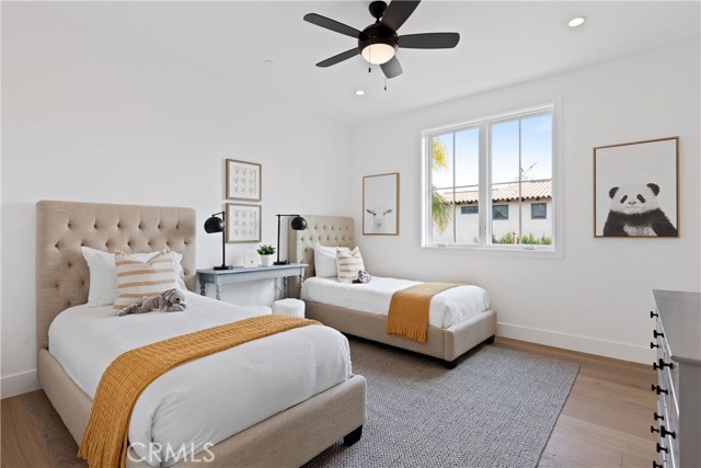 Another ensuite bedroom, with high ceilings, stylish fans and French mullion windows