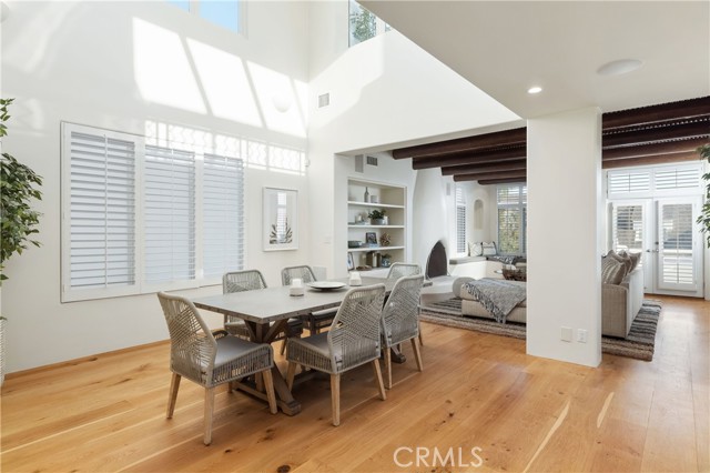 Dining room with dramatic high ceilings.