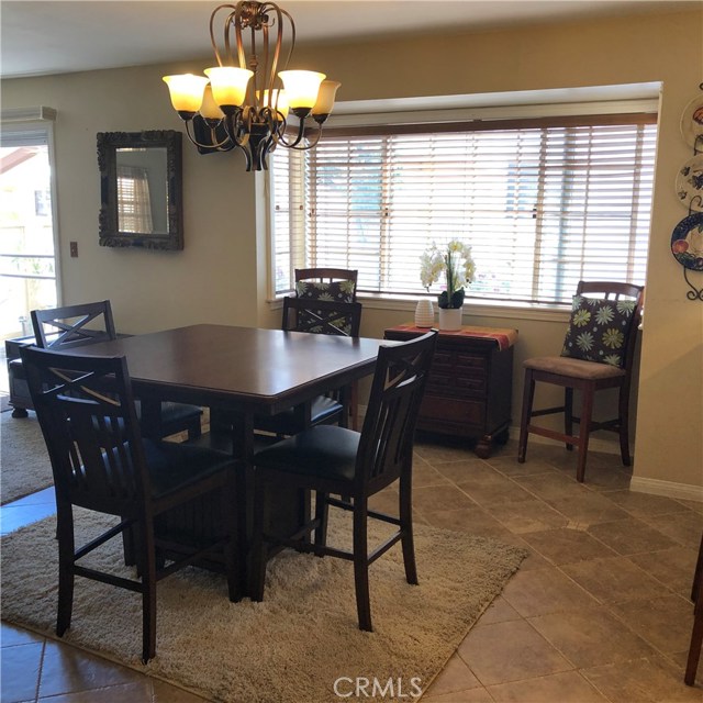Spacious dining area between the kitchen and family room.