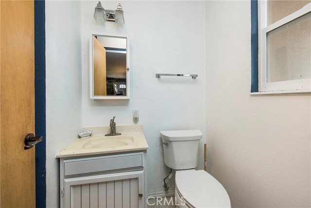 bathroom in garage, shower not shown