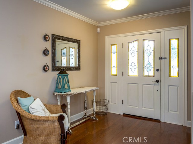 Inviting entryway with wooden floors.