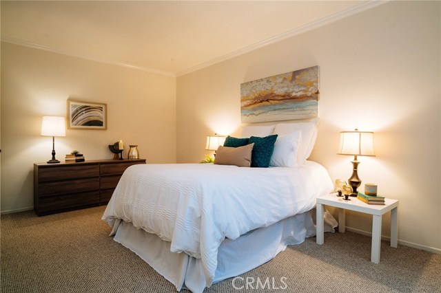 The spacious master bedroom offers a private retreat with dual closets and a master suite.