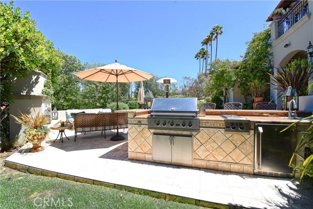 Outdoor kitchen with TV for the chef who enjoys cooking outside.