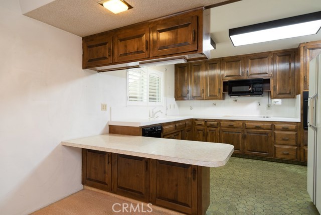 Kitchen has good counter space and breakfast bar. The current cooktop is electric.