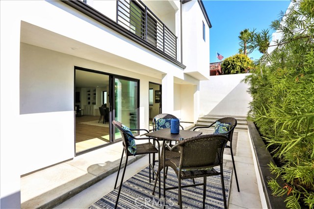 Th Rear Yard has a Tall Privacy Fence, Landscaping and can Accommodate a Barbeque and Seating for Outdoor Entertaining