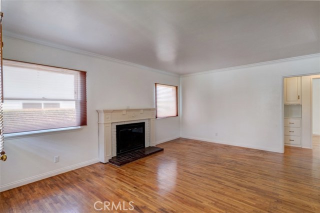 View from the entry toward the bedroom hallway.  Not the Oak floors continue into the bedrooms