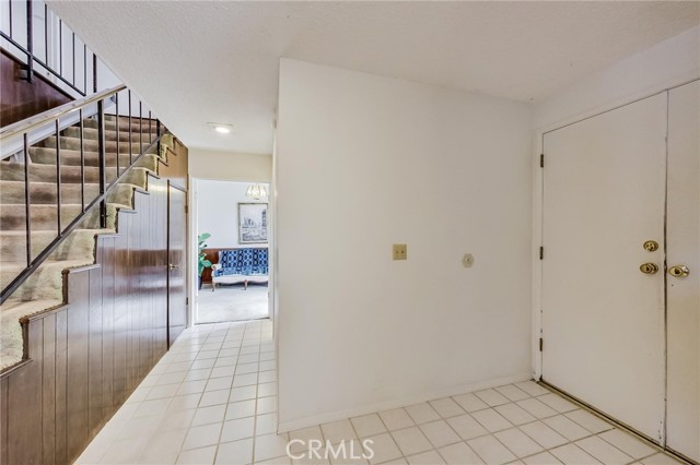 Double door entry foyer with tile floors