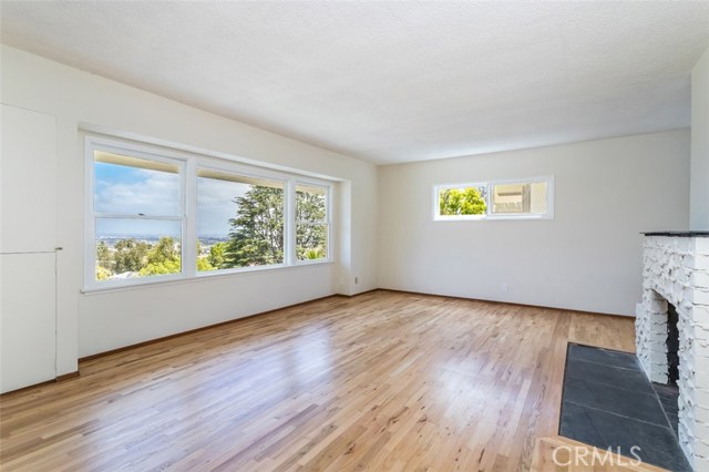 Living room with Southeast views of city, mountains and Torrance airport.