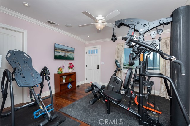 Another lovely bedroom (currently used as a gym), with it's own exterior entrance to the side yard.