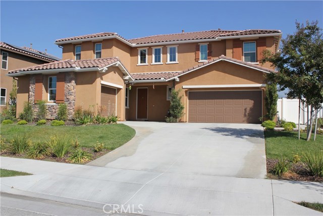 Front of home with professional landscaping.