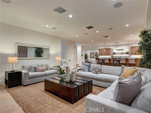 HUGE 1,557 sq. ft. entertainer's dream basement with full bar, dishwasher, ice maker, fridge, 86" TV already installed, surround sound, wired for Dolby Atmos 9.4.2 channel cinema, lounge area, half bath, downstairs bedroom suite.