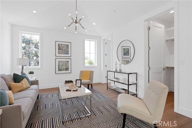 Double doors open to this ensuite bedroom (shown here as  yet another gathering space)