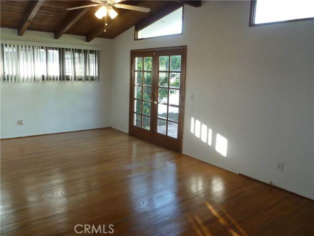 Master Bedroom with French Doors leading to Grassy Backyard