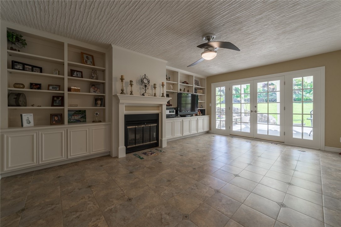 Additional view of your second family room with fireplace included leads you through the french doors...