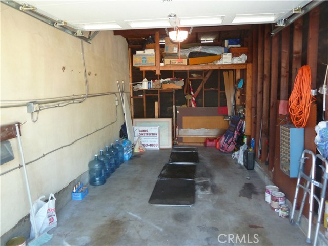 Single garage with storage shelve. Single garage with storage shelve.