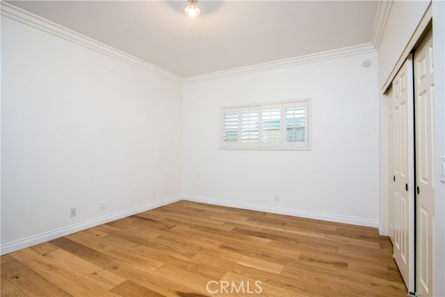 Downstairs 3rd bedroom with engineered french oak hardwood floors and tall ceilings