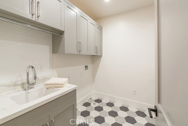 laundry with sink..hexagon tiled floor