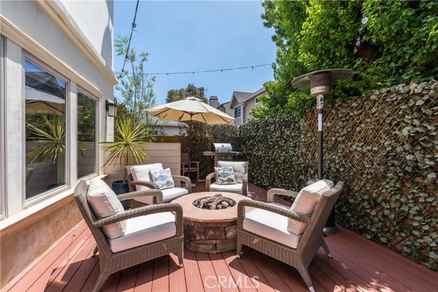 View of the outdoor fire pit area.  Greener surrounds you...gorgous!