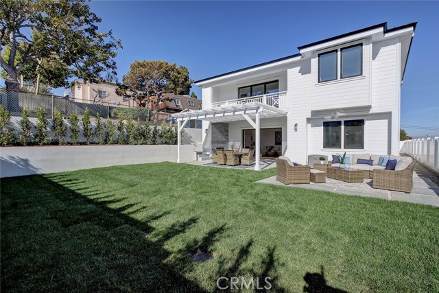 Large Grassy backyard with 2 tiled patio areas