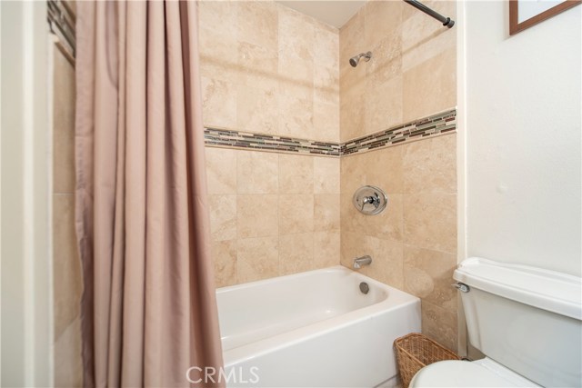 Beautifully updated bathroom with tile shower, granite counters, new lights and more