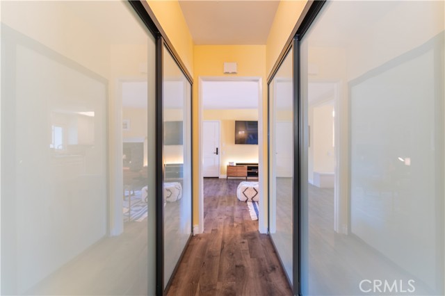 Hallway, with storage on both side.